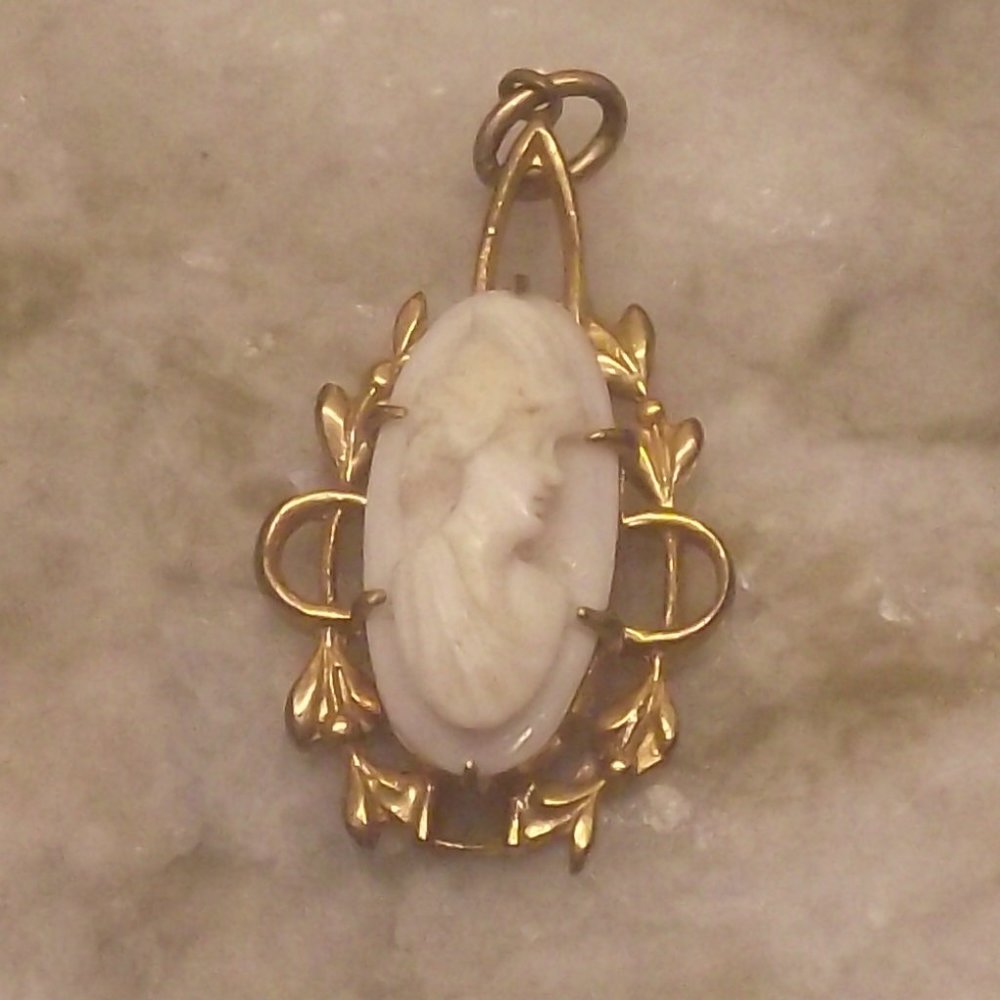 Small white cameo pendant